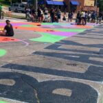 Black Lives Matter is painted in giant letters on the street