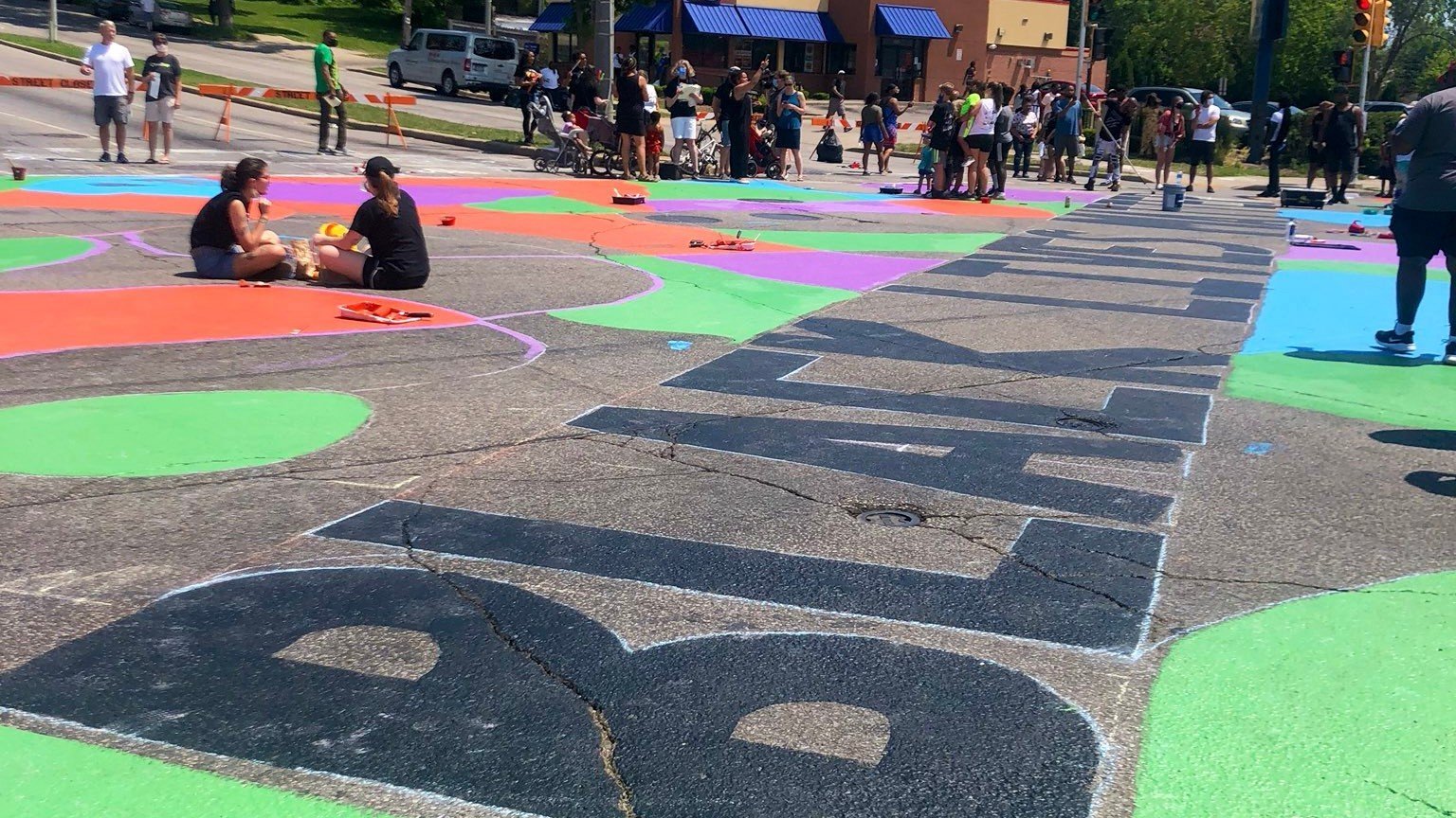 Black Lives Matter is painted in giant letters on the street