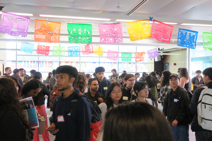 Group of people in Building 700 South celebrating La Bienvenida