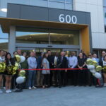 People gathered to cut ribbon for Chabot Library