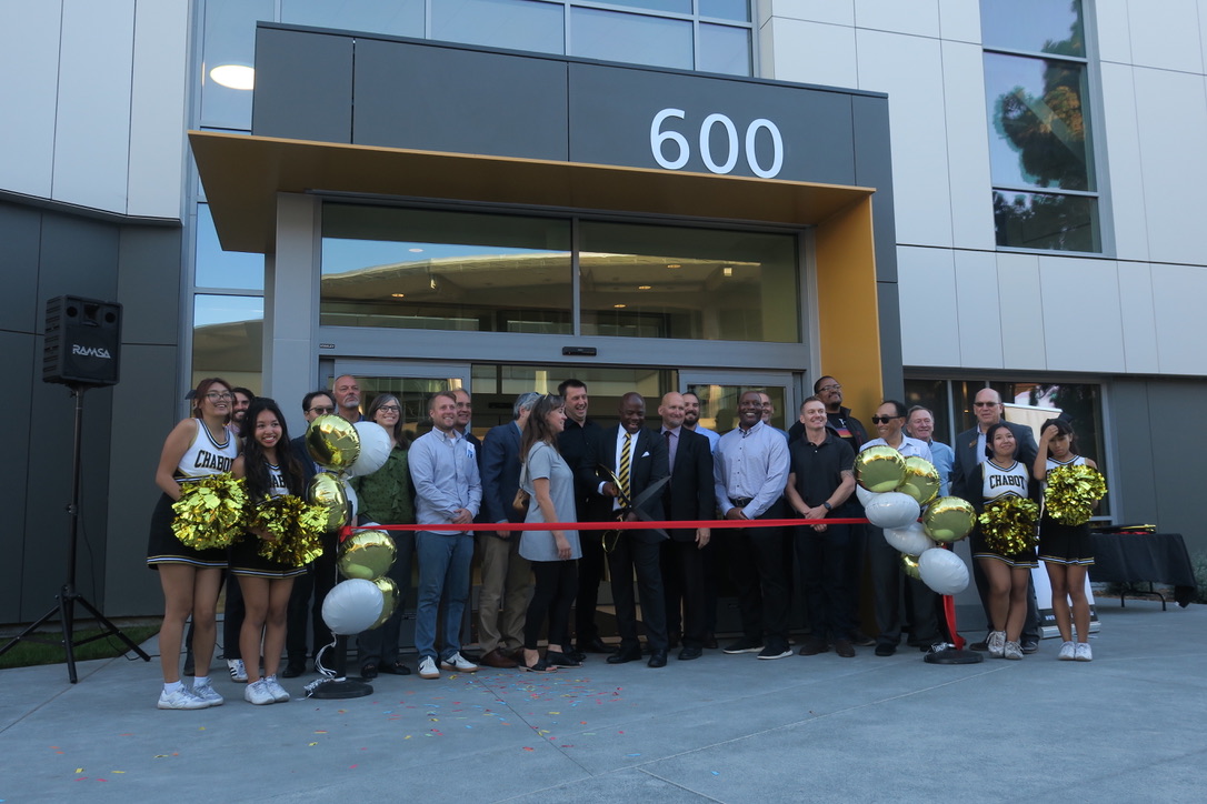 People gathered to cut ribbon for Chabot Library