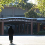 Student walking towards Chabot College's entrance