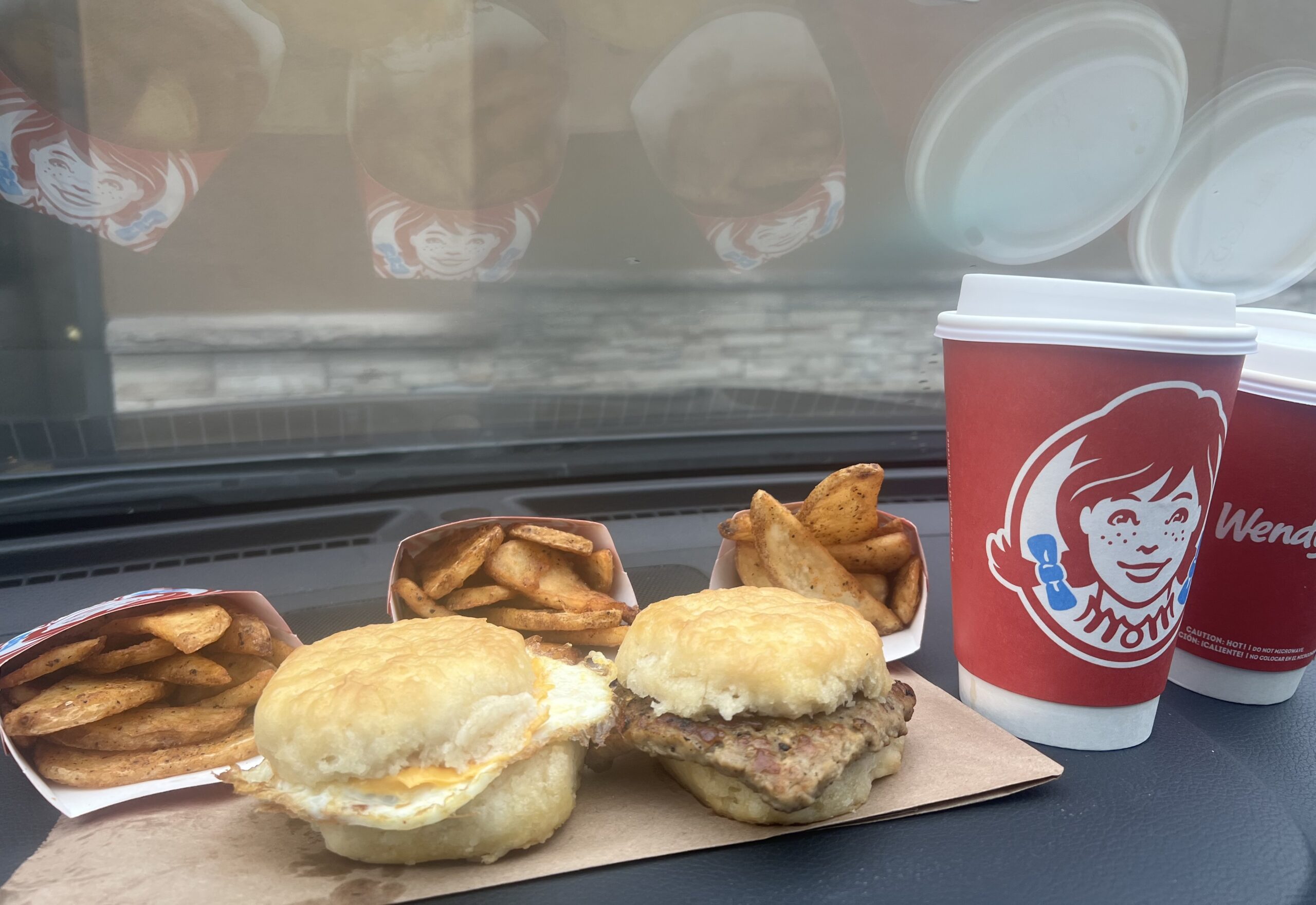 Breakfast biscuit sandwiches; small seasoned potatoes & regular hot coffee