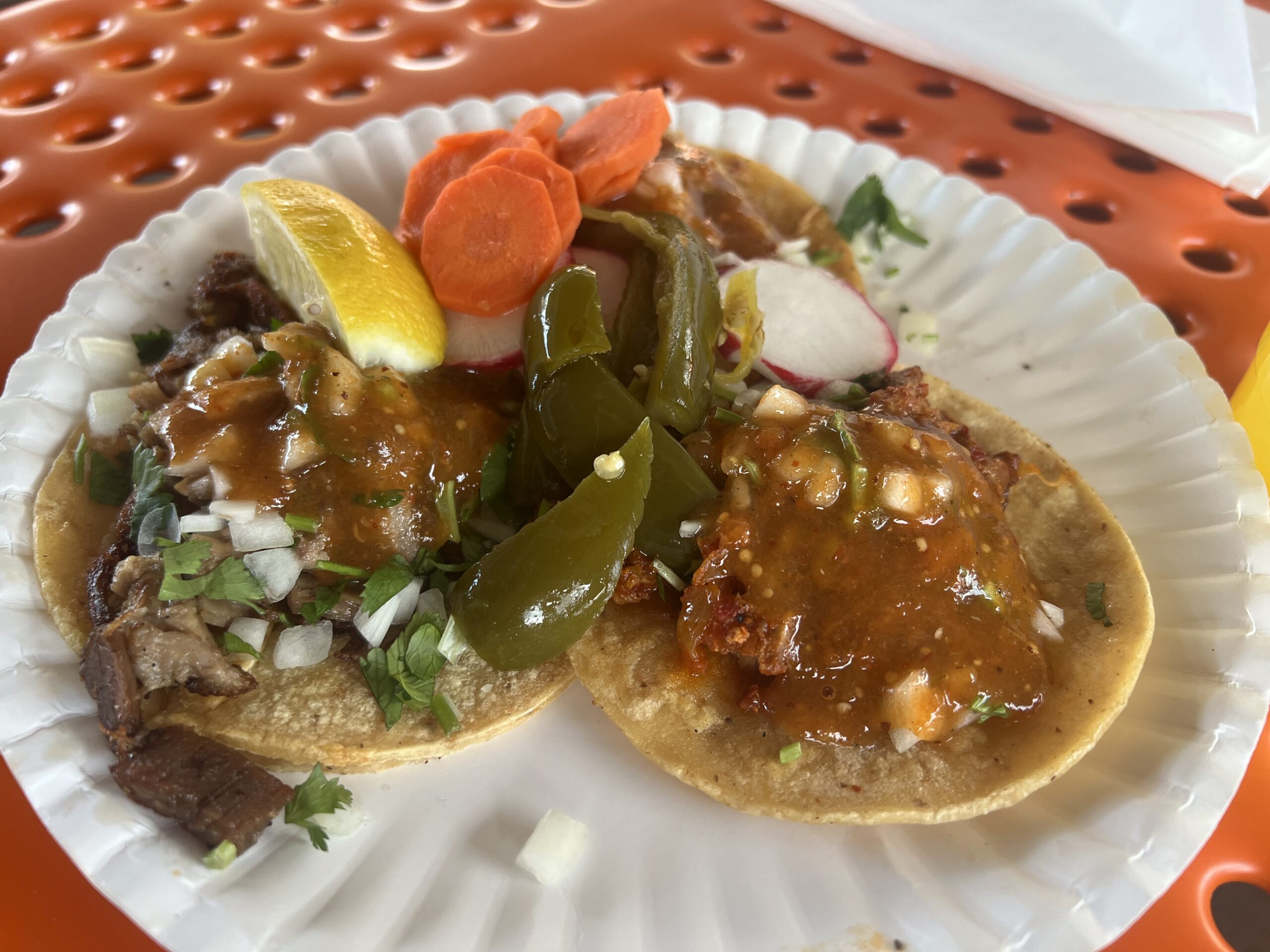 Three tacos, al pastor and suadero protein; included salsa and sides as toppings